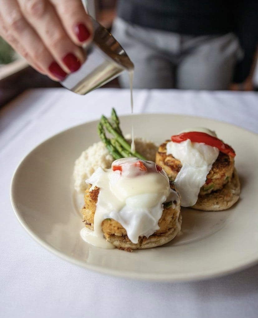 Egg Benedict with sauce at Amergio Italian Restaurant from the brunch menu