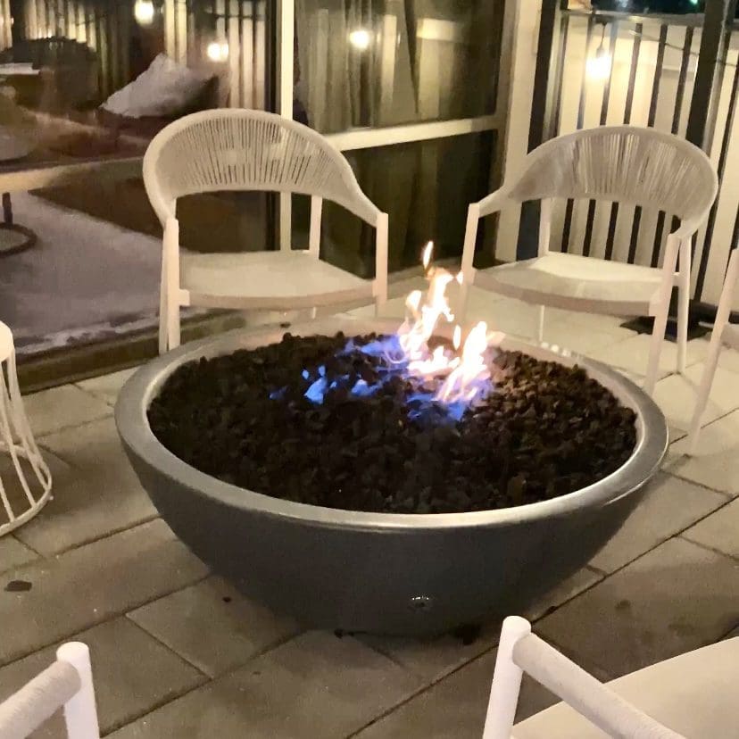 Firepit outside of the Cotton House hotel with sitting area